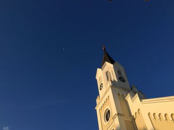 Low angle view of building against blue sky