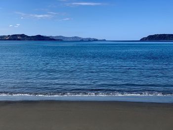 Scenic view of sea against blue sky