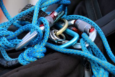 Close-up of blue climbing rope on bag