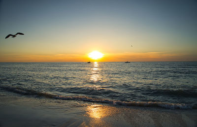 Scenic view of sea against sky during sunset