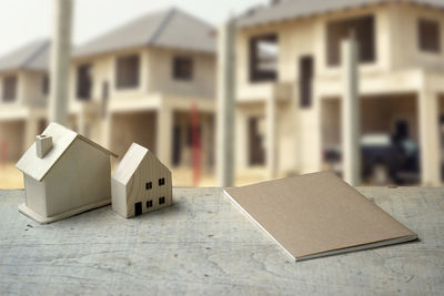 Close-up of toy on table against building