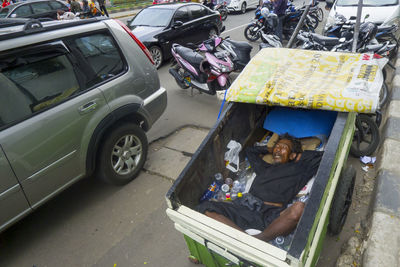 High angle view of man sitting in car