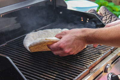 Midsection of man preparing food