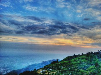 Scenic view of landscape against cloudy sky