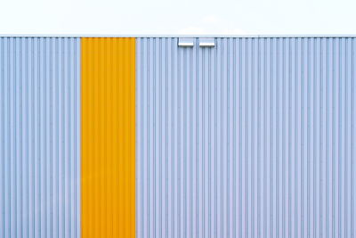 Close-up of yellow wall of building