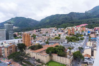 High angle view of buildings in city against sky