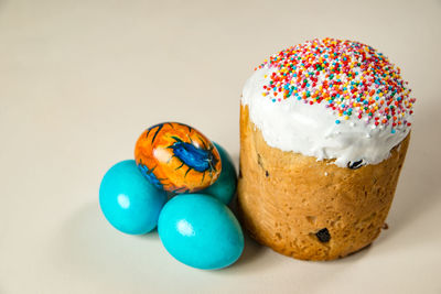 Close-up of multi colored candies against white background