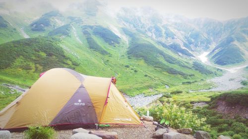 Aerial view of tent on mountain