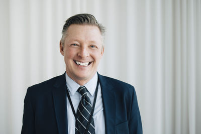 Portrait of happy entrepreneur in office