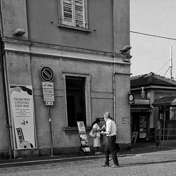 Woman standing on city street