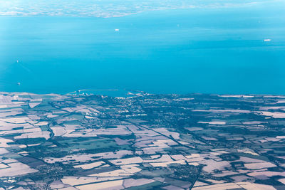 High angle view of buildings by sea