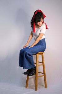 Young woman sitting on chair