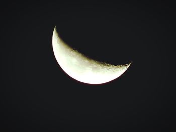 Low angle view of moon in sky at night