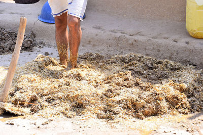 Low section of man working at construction site