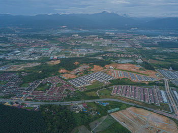 Aerial panoramic view of cityscape and new residential area in meru, perak, malaysia.