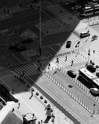 High angle view of people walking on street in city