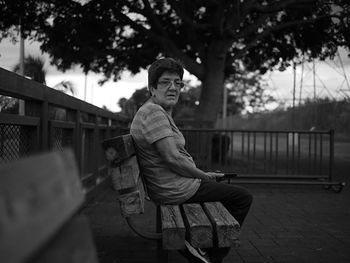 Rear view of woman standing in park