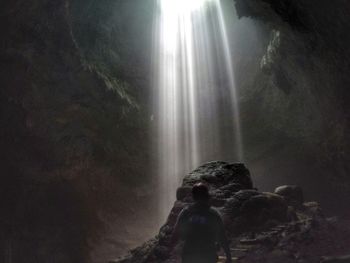 Panoramic view of waterfall in forest