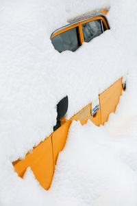 Close-up of snow covered vehicle