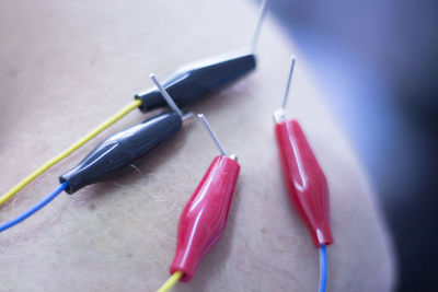 High angle view of electrical equipment on human skin