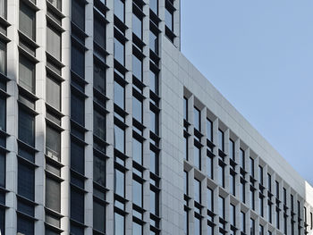 Low angle view of modern building against clear sky