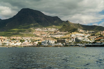 Tourist resorts at costa los gigantes seen from a boat in the atlantic