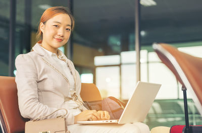 Young businesswoman using laptop