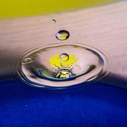 High angle view of drop splashing water