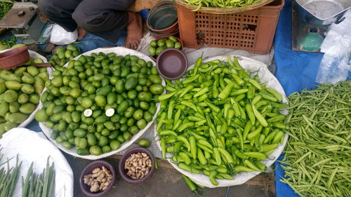 Low section of vendor selling vegetables in market