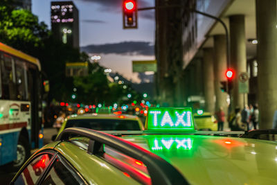 Close-up of illuminated city street at night