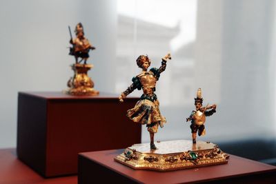 Close-up of angel statue on table