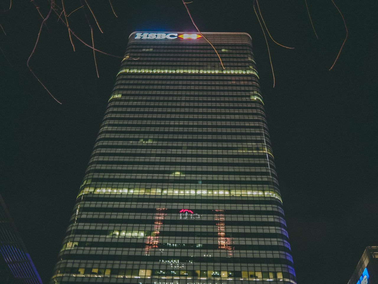 LOW ANGLE VIEW OF ILLUMINATED BUILDINGS AGAINST SKY