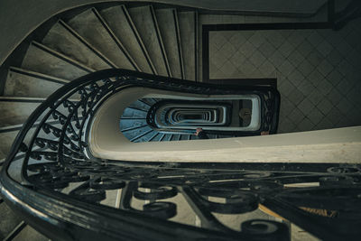 Directly below shot of spiral staircase of building