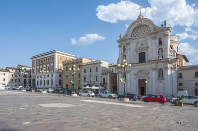 The beautiful piazza duomo in l'aquila with historic buildings and churches