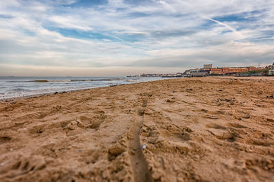 Scenic view of beach against sky