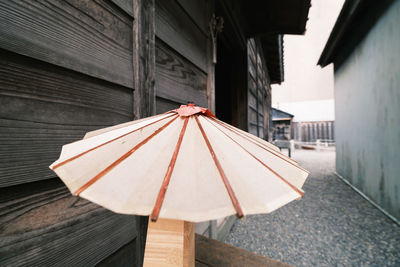 Close-up of umbrella on roof of building