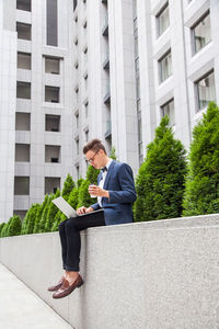 Man using mobile phone in building