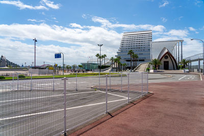 View of modern building in city against sky