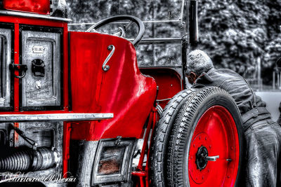 Close-up of red truck against wall