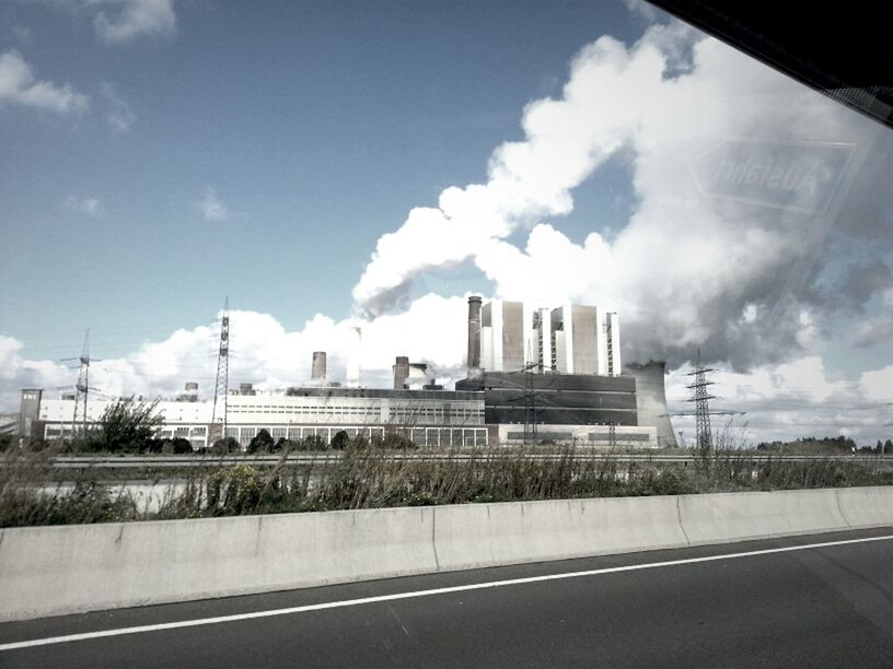 sky, architecture, built structure, building exterior, cloud - sky, road, city, transportation, cloud, cloudy, modern, glass - material, skyscraper, road marking, street, office building, the way forward, day, building, connection