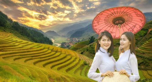 Portrait of a smiling young woman on field