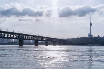 Bridge over sea against sky