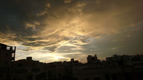 Cityscape against sky during sunset