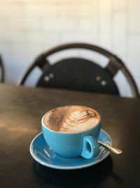 Close-up of coffee cup on table