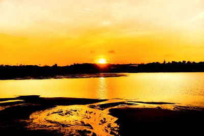 Scenic view of sea at sunset