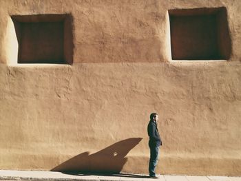 Full length of woman standing in building