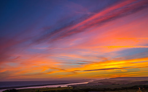 Scenic view of dramatic sky during sunset