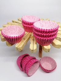 Close-up of cupcakes on table against white background