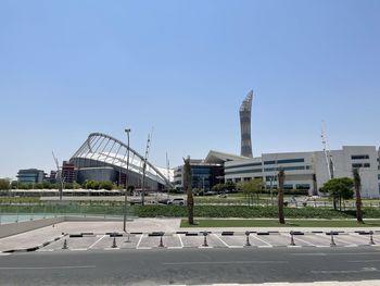 Buildings in city against clear sky