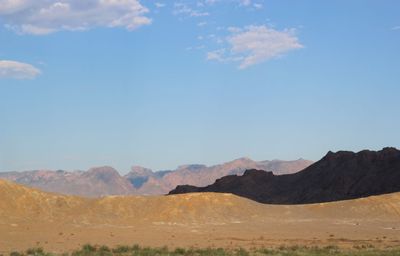 Scenic view of landscape and mountains against sky